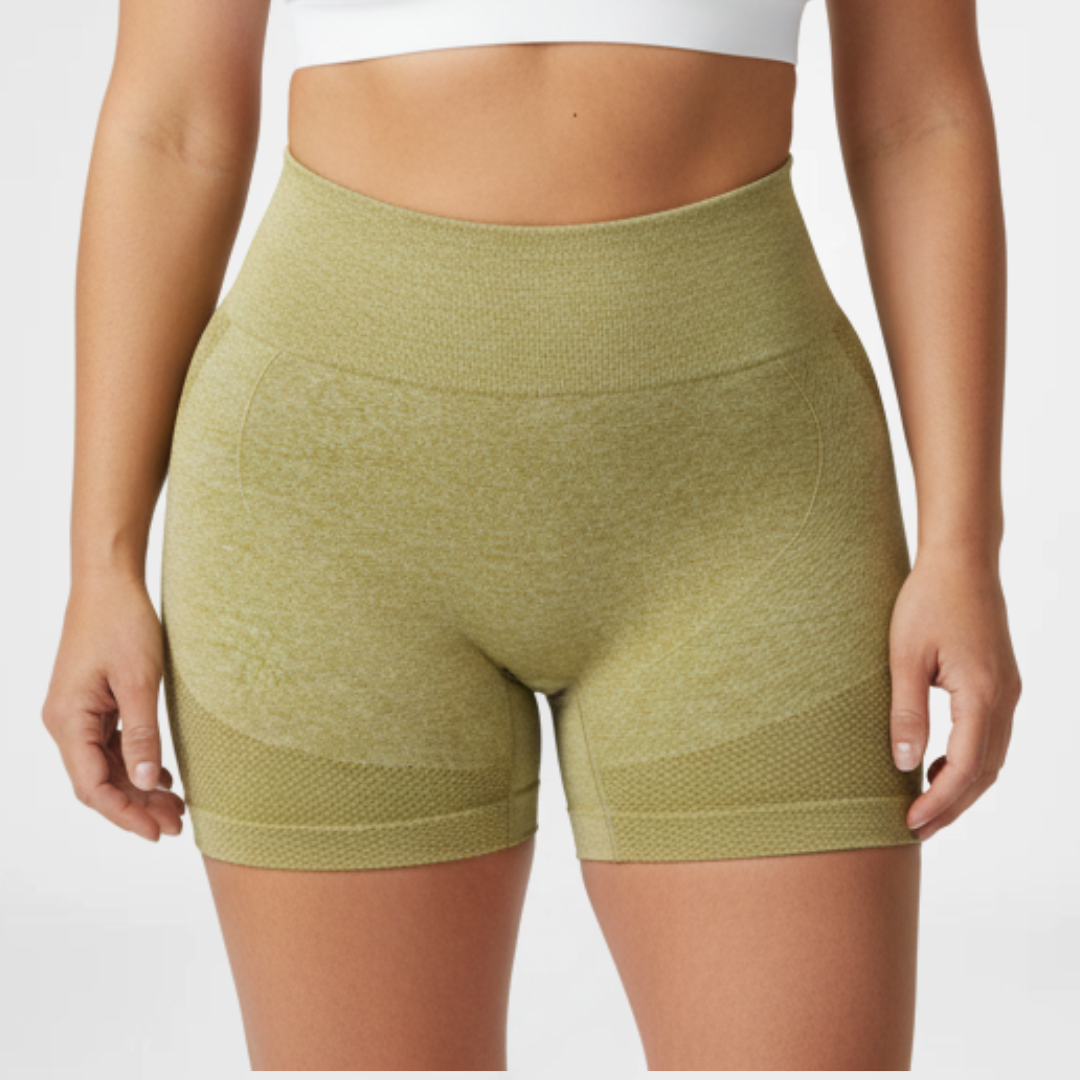 Green athletic shorts worn by a person on a white background