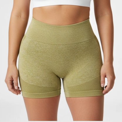 Green athletic shorts worn by a person on a white background