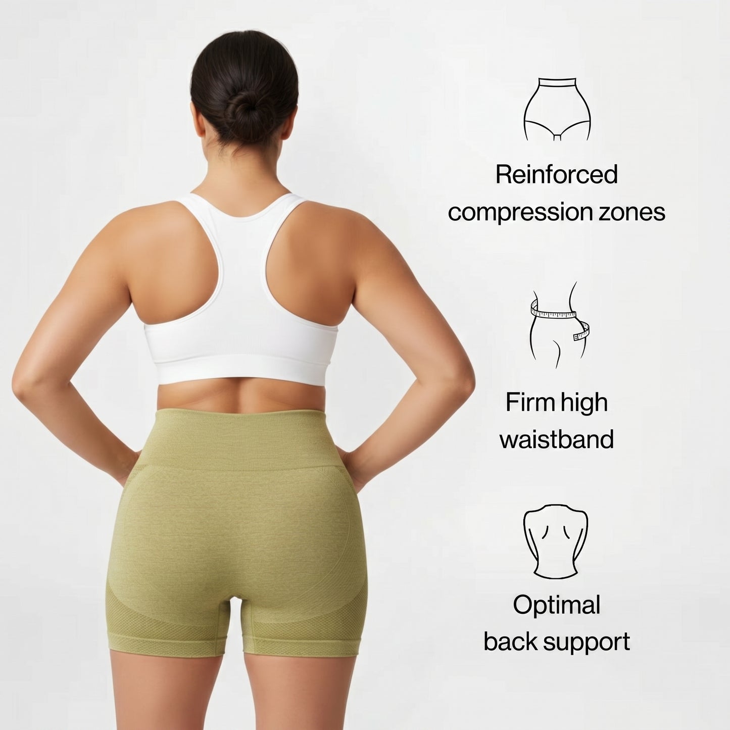 Woman wearing green compression shorts with text on a white background
